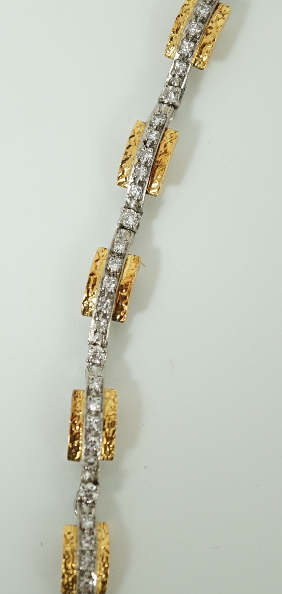 A 20th century two colour gold and diamond set necklace